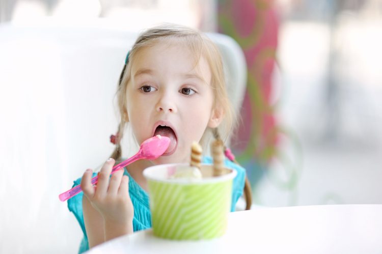 40753841 - adorable little girl eating ice cream at summer