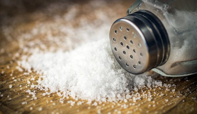 Salt on wooden background